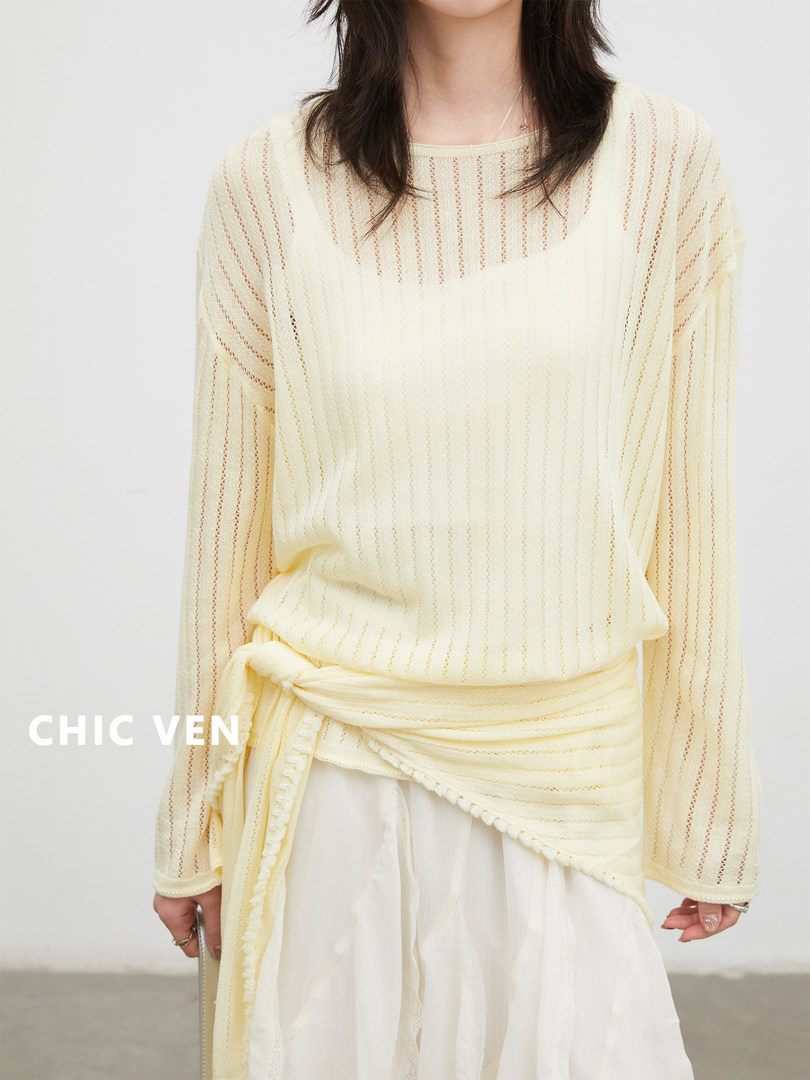 Model wearing a cream sheer long-sleeve knit top with a wrap detail
