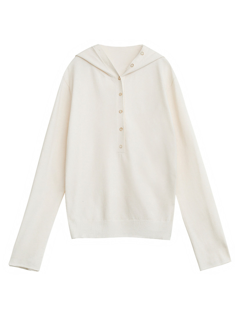Cream long-sleeve hooded button-up sweater laid flat on a white background