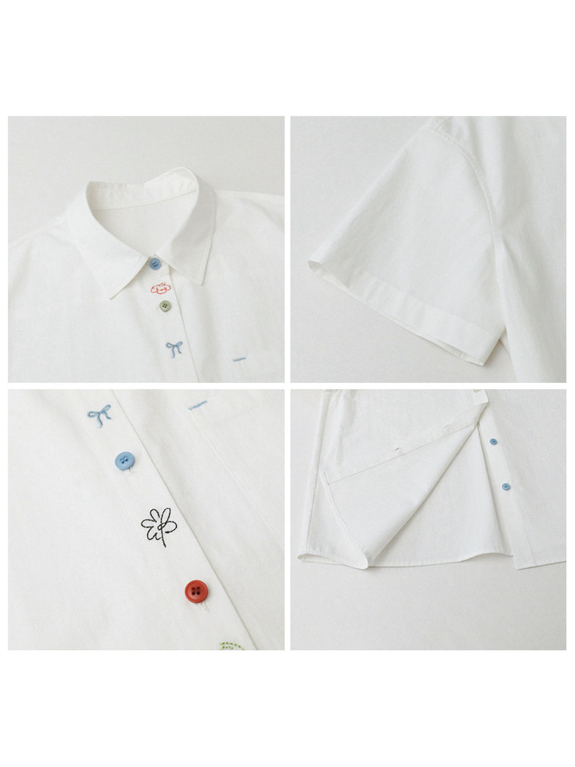 White short-sleeve button-up shirt with colorful embroidered details