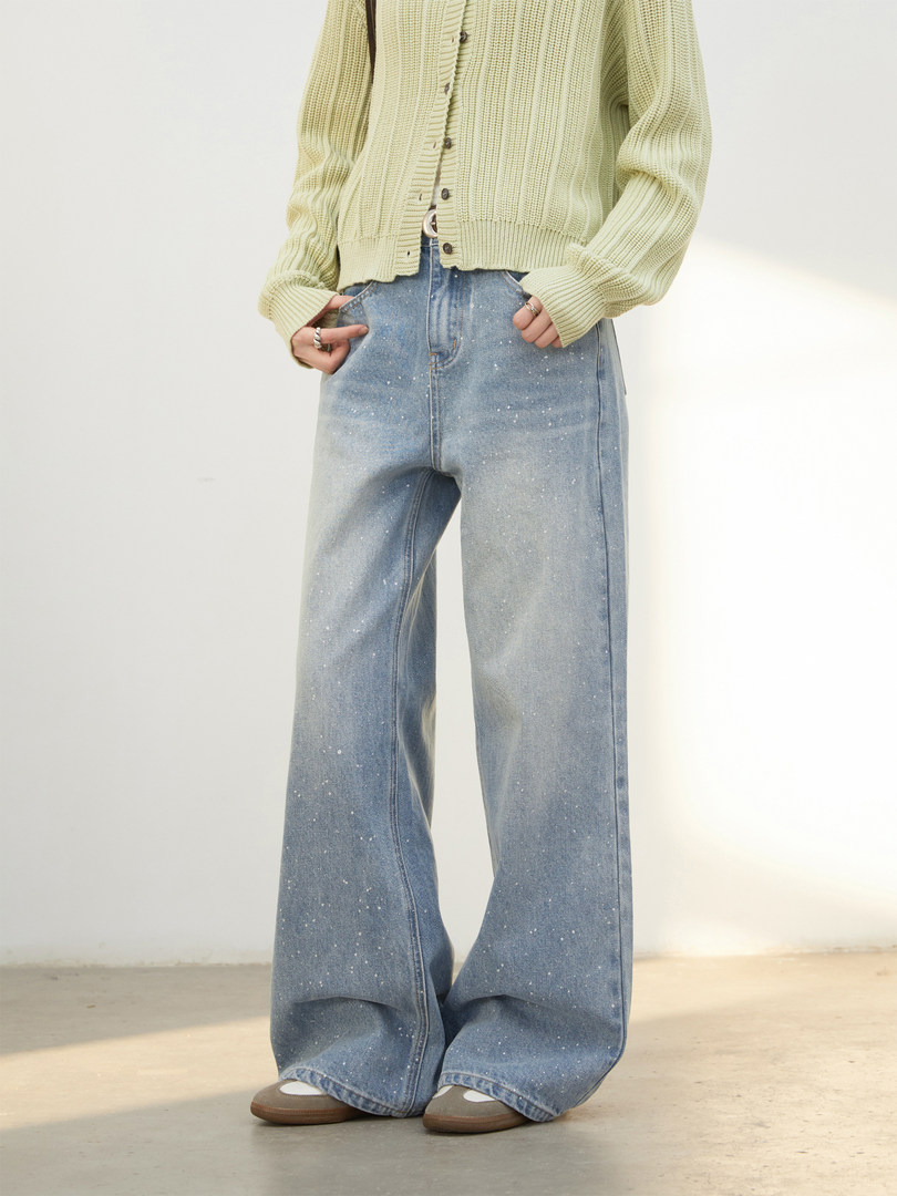 Model wearing light wash wide-leg jeans with a pale knit cardigan