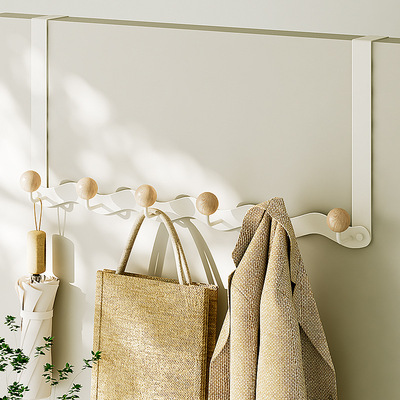 Hanging clothes rack behind the door to store magical items