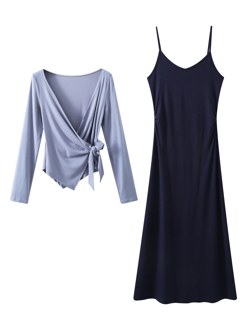 Two-piece women’s clothing set with a light blue wrap top and a black slip dress on a white background
