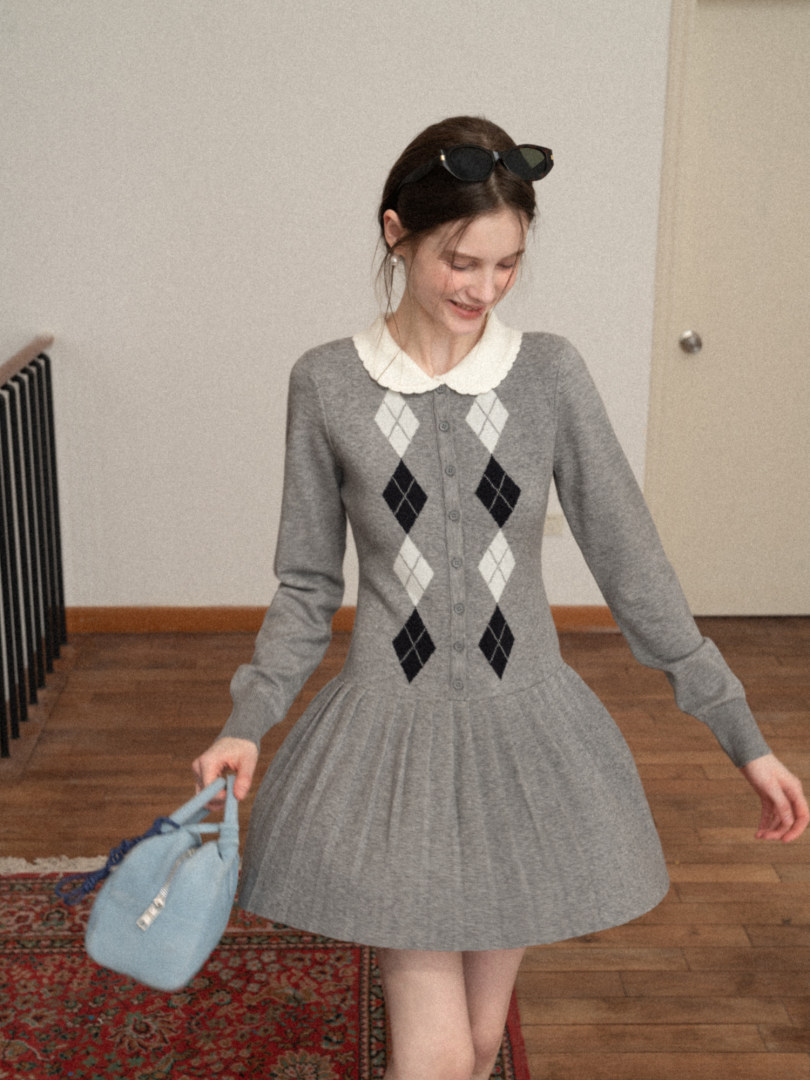 Gray long-sleeve argyle knit dress with a white collar, worn by a model