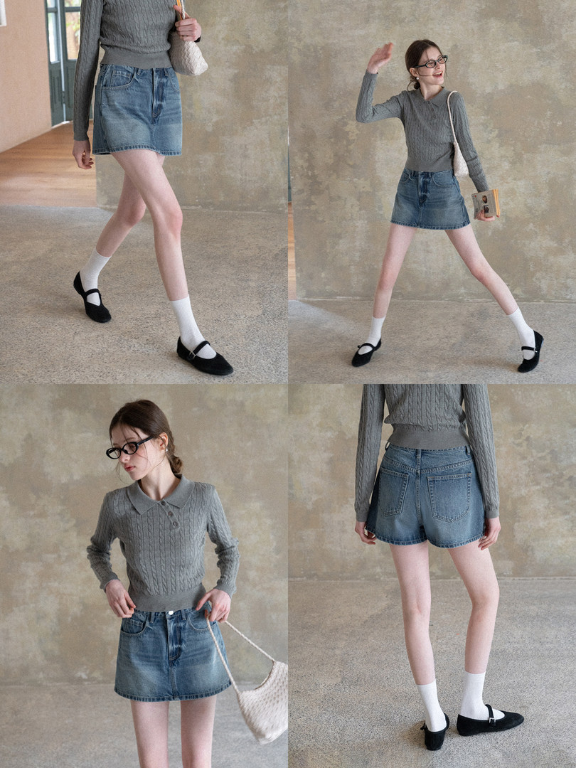 Model wearing a gray knit top with a denim mini skirt and black flats