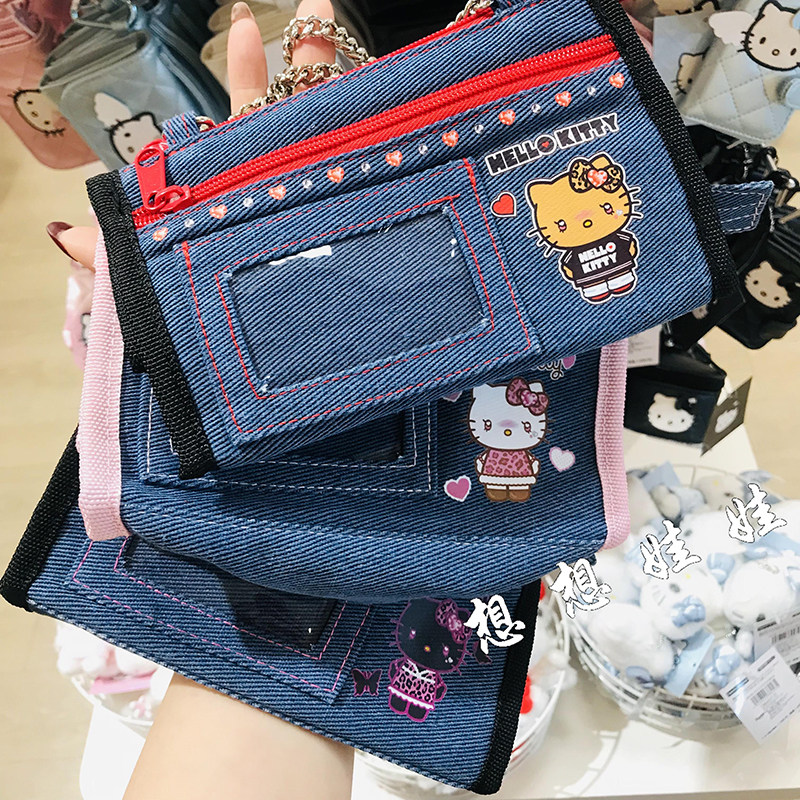 日本三丽鸥kitty尾巴牛仔帆布小手提包小物翻包化妆包收纳袋笔袋