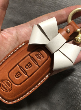 适用于尼桑钥匙套轩逸逍客壳扣天籁奇骏全包骐达ariya艾睿雅真皮