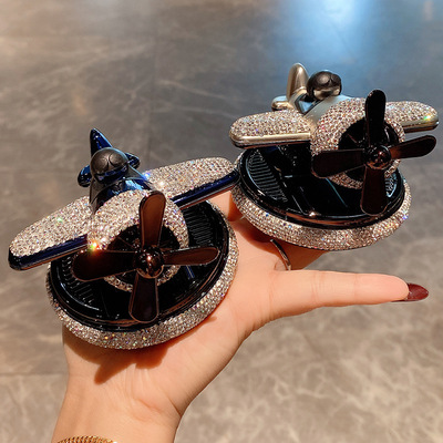 镶钻汽车摆件饰品太阳能旋转霄云直升机车载香薰飞机汽车香水