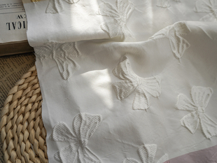 色织浮雕提花布料黑色蝴蝶结提花面料立体提花女装连衣裙箱包布料