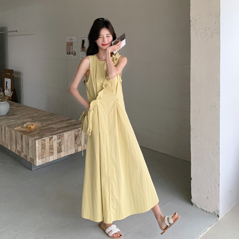黄色温柔风背心连衣裙女2025夏新款法式高级感独特减龄显瘦a字裙图片