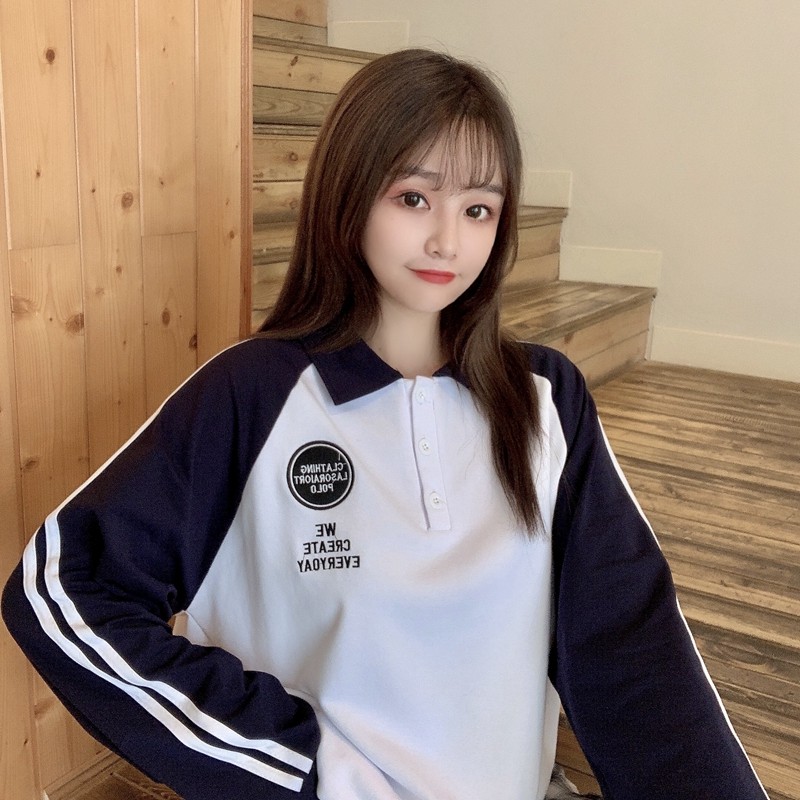 Real photo of student long sleeve loose T-shirt with fresh contrast collar and interesting embroidery
