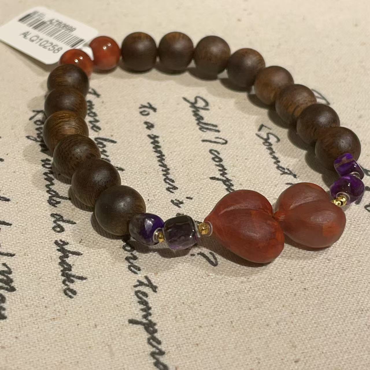 绿奇楠0.8南红屁桃舒俱来丝绒方珠手串18K/.ALQ10258