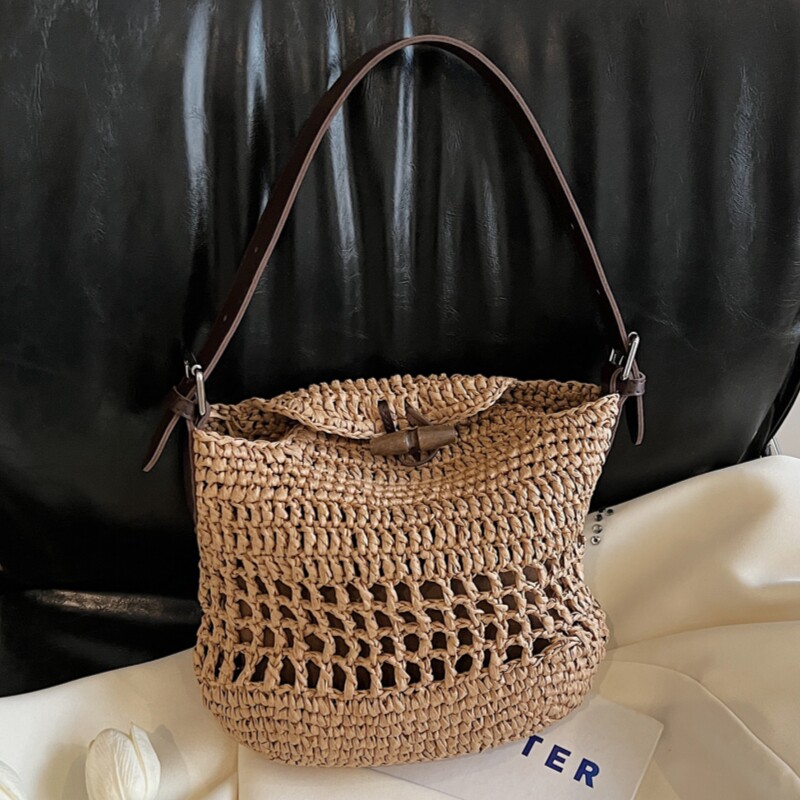 水桶包包女2025夏季新款民族风草编包沙滩包百搭编织通勤单肩包潮
