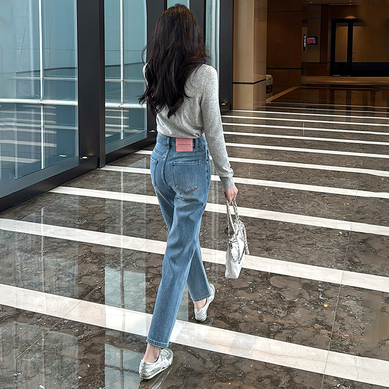 蓝色四面弹粉标九分烟管牛仔裤