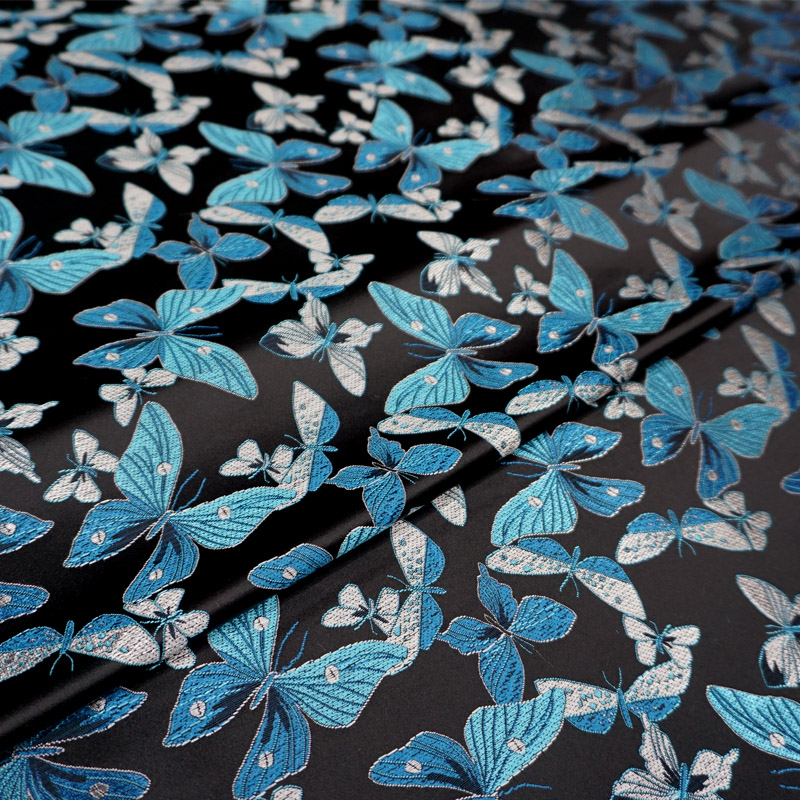 黑色底湖蓝色缎面飞舞小蝴蝶秀气花枝织锦缎布料 古香丝绸面料
