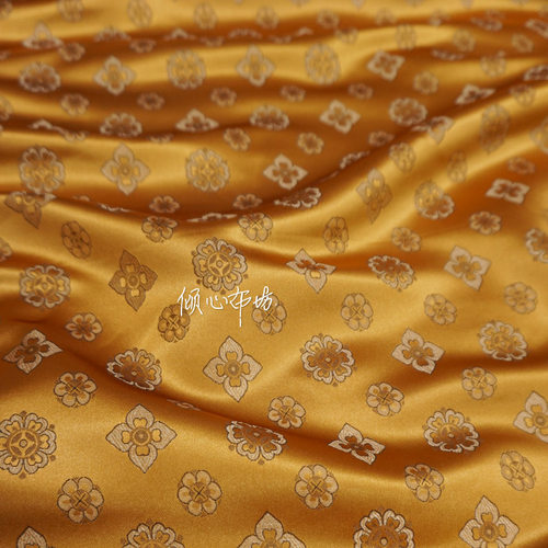 姜黄色可爱隋唐朝朵花纹柿蒂纹土黄色织锦缎布料国潮丝绸缎子面料