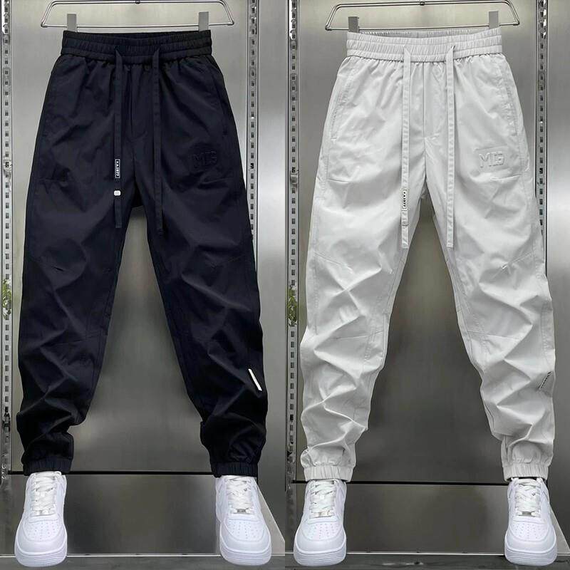 网红痞帅男士休闲工作服裤子秋季新款修身纯色运动裤高端束脚烟管