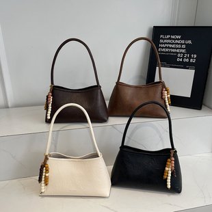 天彩翼飞小众手提单肩包女2025秋冬新款复古腋下包质感通勤法棍包