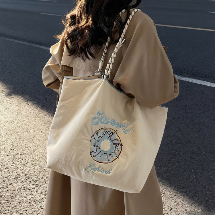 包包手提2025新款女式网红同款刺绣环保袋购物袋休闲尼龙帆布大包