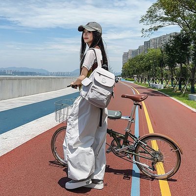 米熙轻便双肩包女2025新款大容量防水高颜值旅游旅行小背包书包男