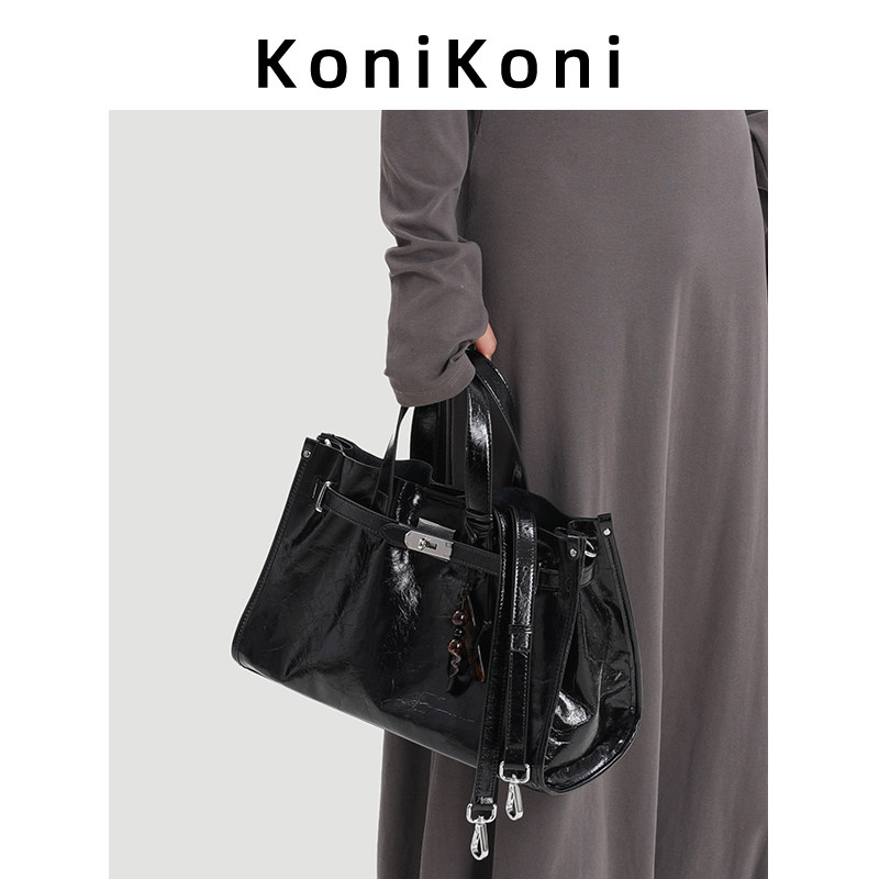 KoniKoni真皮设计手提包女2026新款高级感通勤大容量托特包斜挎包