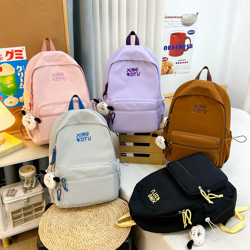 新款轻便旅行背包刺绣潮流初高中大学生书包大容量百搭简约双肩包