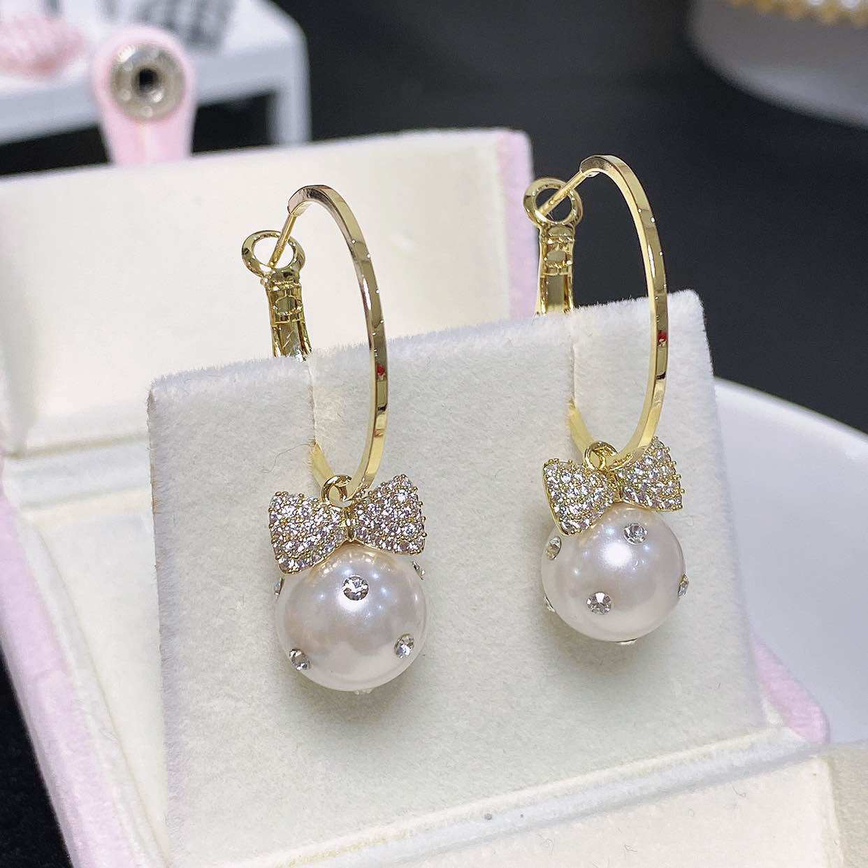 丽银饰品2022新款女蝴蝶结珍珠耳环中长款耳圈满锆石微镶银针耳饰