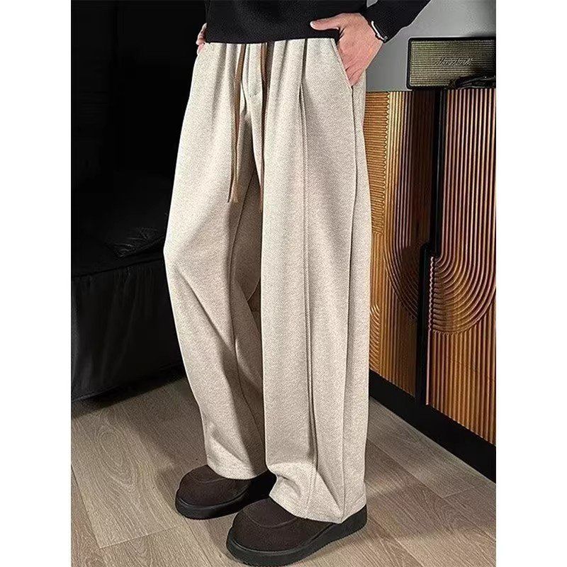 卫裤米杏色裤子男款弯刀加厚秋冬