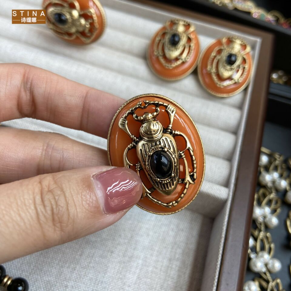 STINA俄罗斯金款滴油橙色复古昆