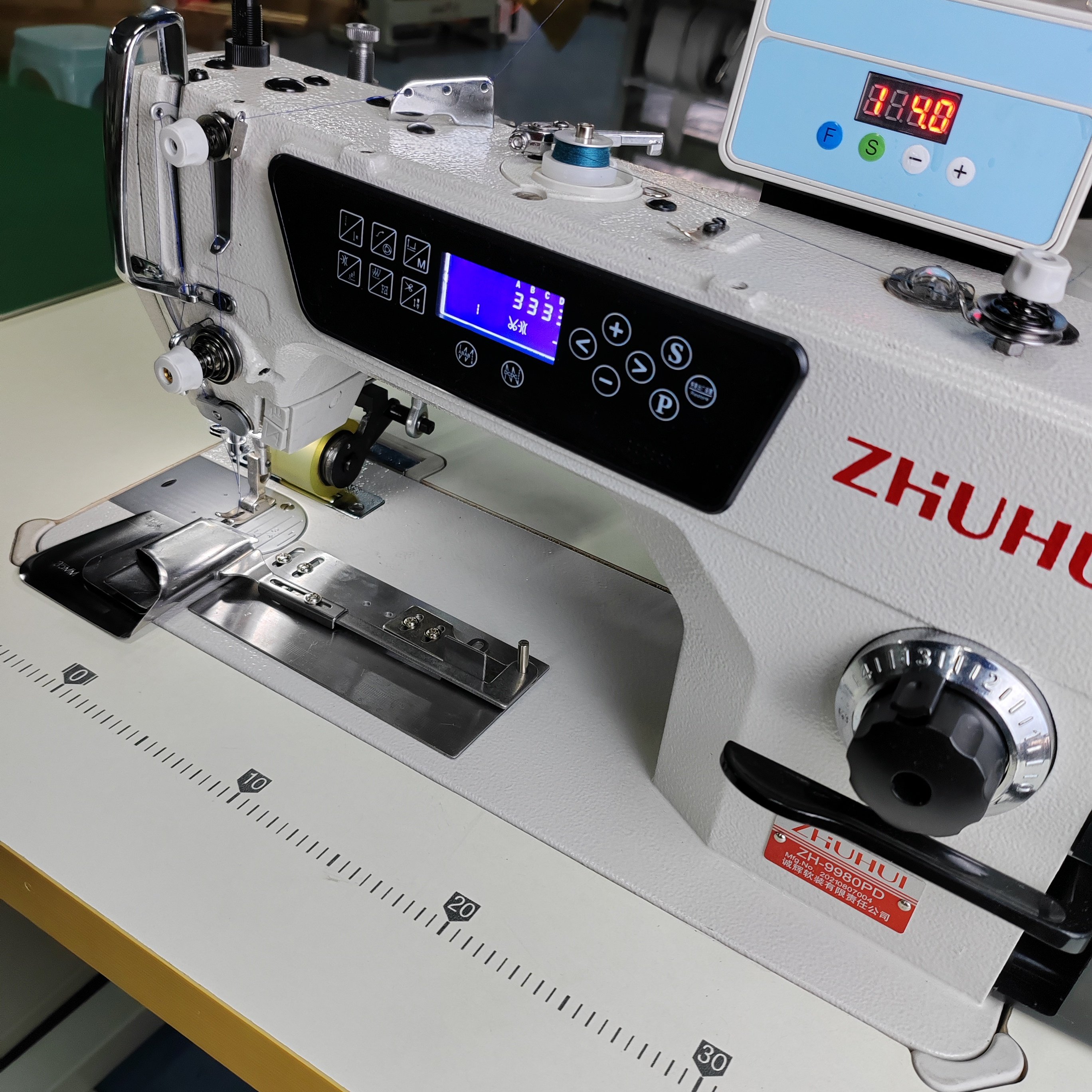 ZHUHUI自动同步拖轮拖布台卷边机