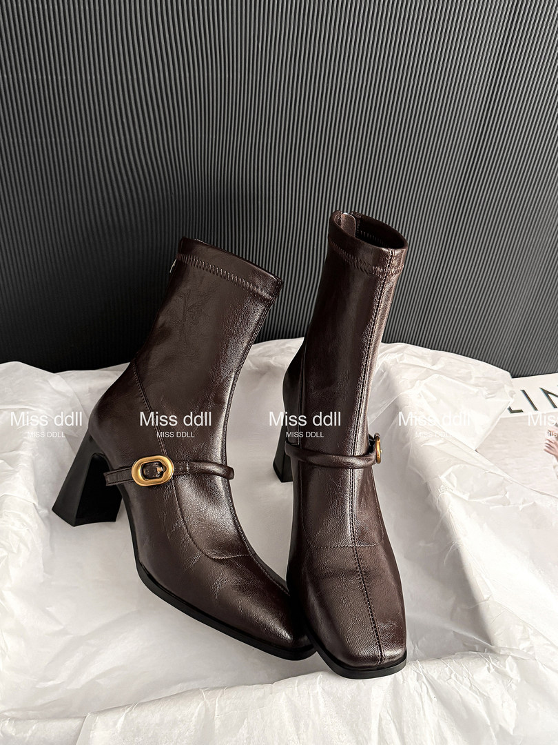 Brown leather ankle boots with block heels and gold buckle detail