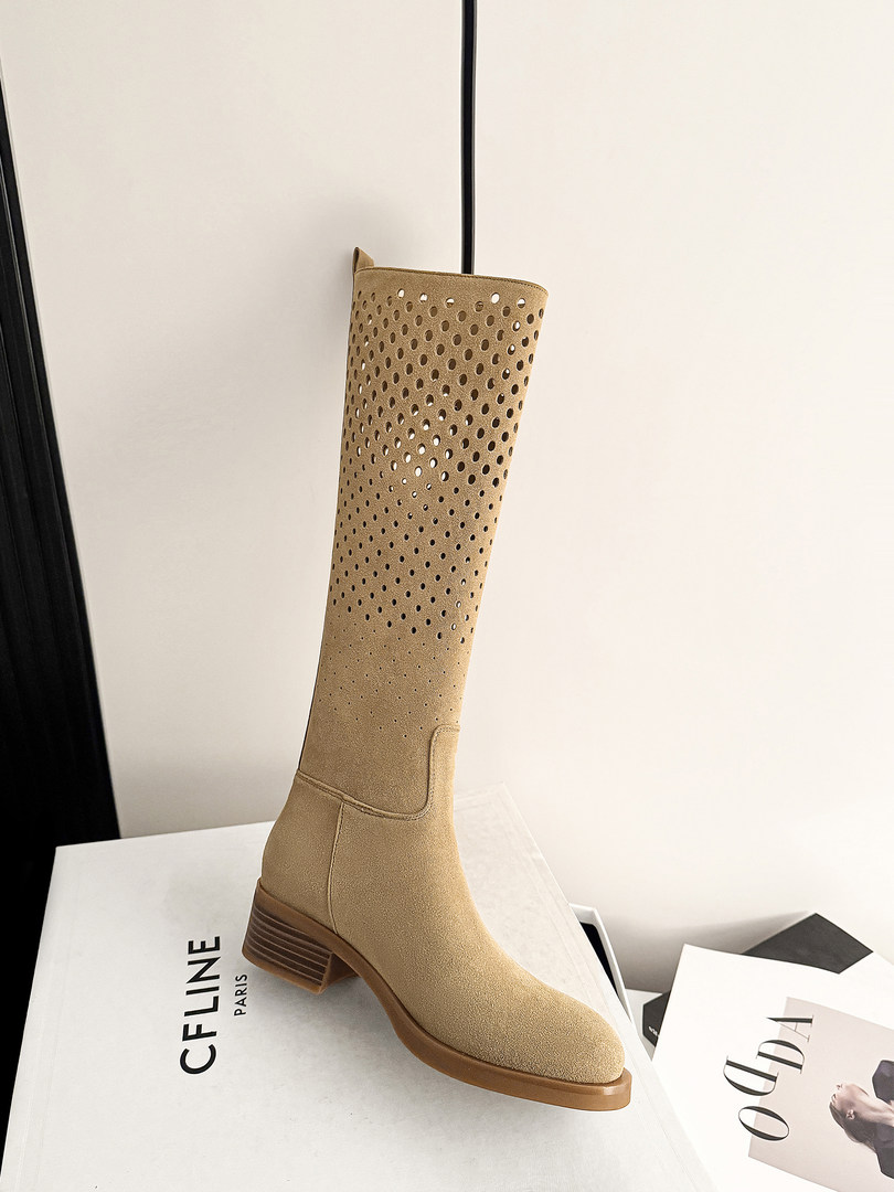 Tan knee-high suede boot with perforated shaft and block heel