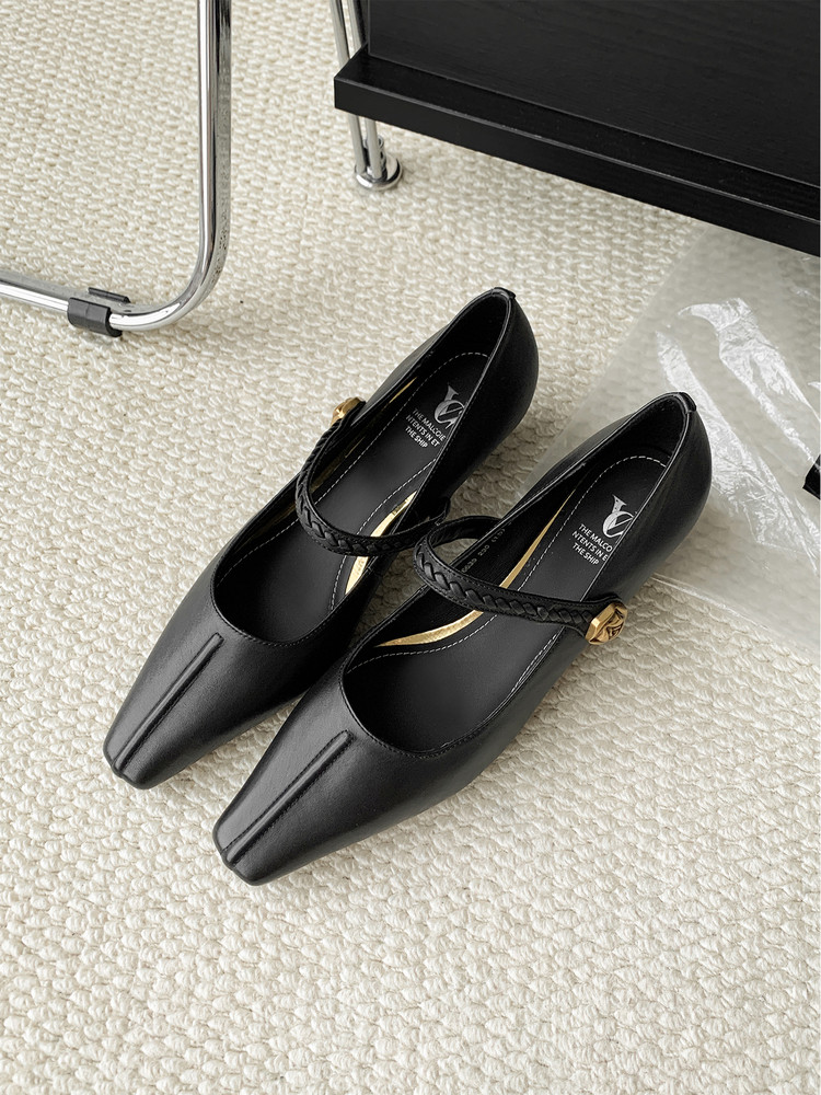 Black pointed-toe dress shoes with braided ankle straps