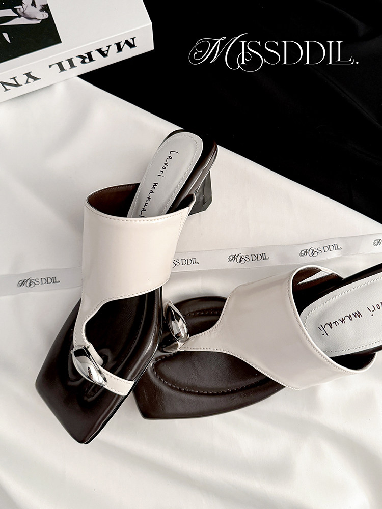 Two-tone heeled slide sandals with white straps and dark brown soles