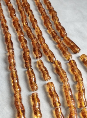 s514 10x36mm长条扭型洒金琉璃珠一条