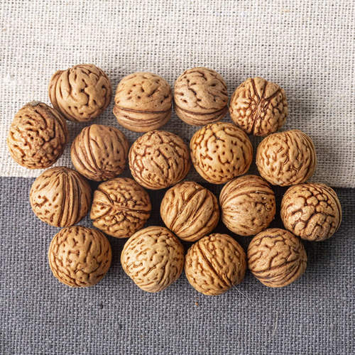 2025年野生桃核手串料桃胡近圆料脑纹打孔和不打孔的桃核拍打袋