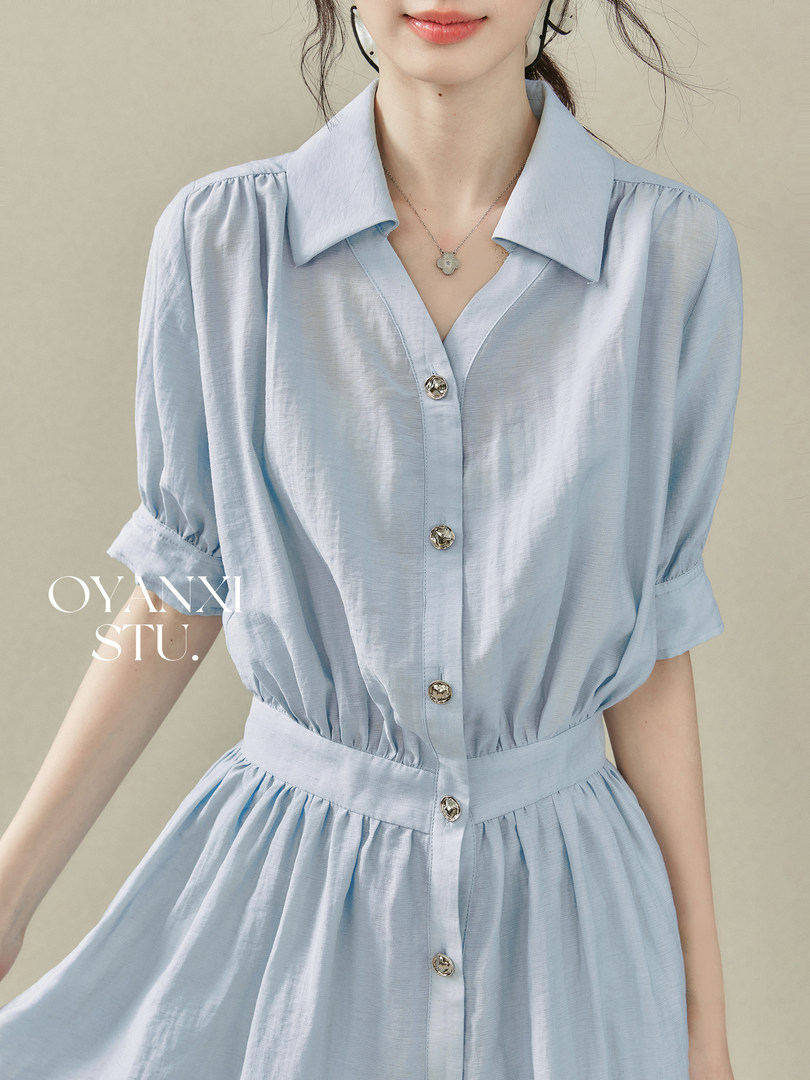 Light blue short-sleeve button-front dress worn by a model