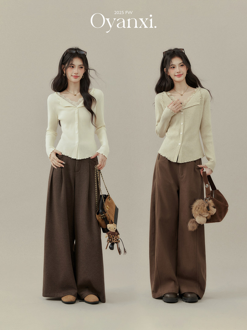 Two models wearing cream ribbed cardigans and brown wide-leg pants