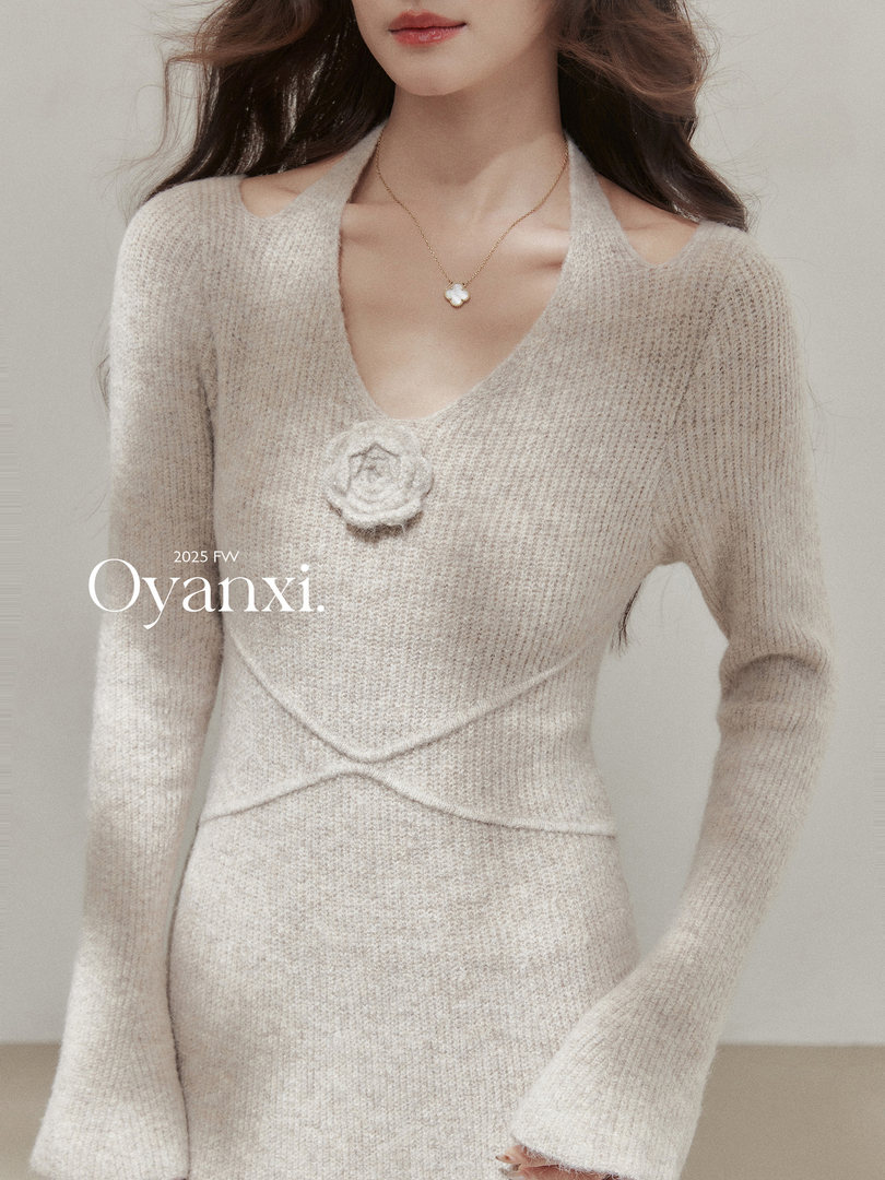 Cream knit long-sleeve sweater dress worn by a model