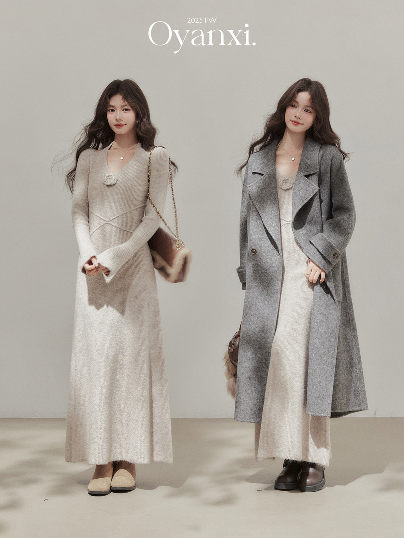 Two women modeling a beige knit dress and a gray wool coat in a fall/winter fashion photo