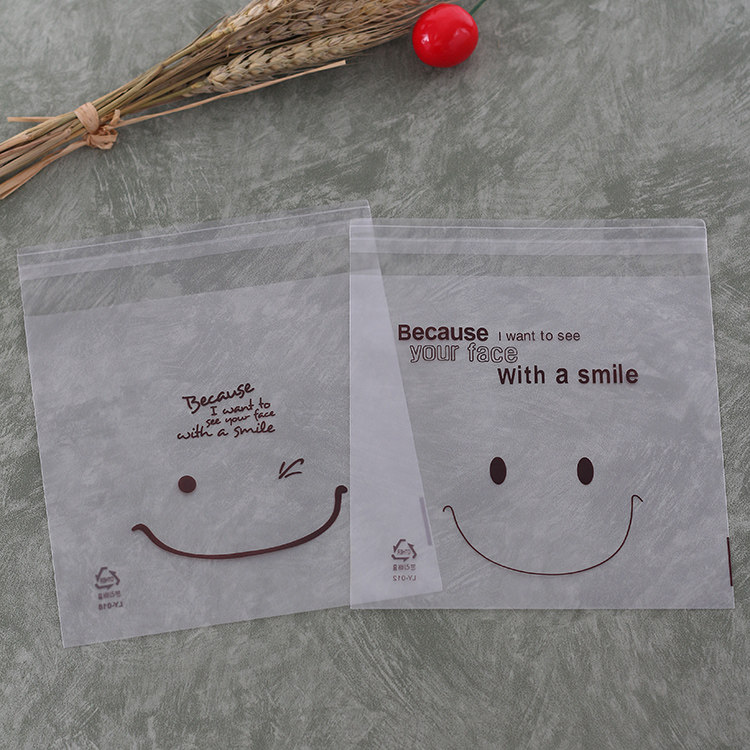 厂家直销韩版可爱笑脸饼干袋蛋糕包装袋 opp自粘烘焙袋14*14+3