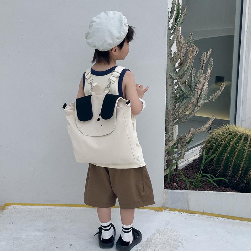潮帆布小狗儿童旅游背包女孩可爱男童双肩包学院风小学生书包可爱