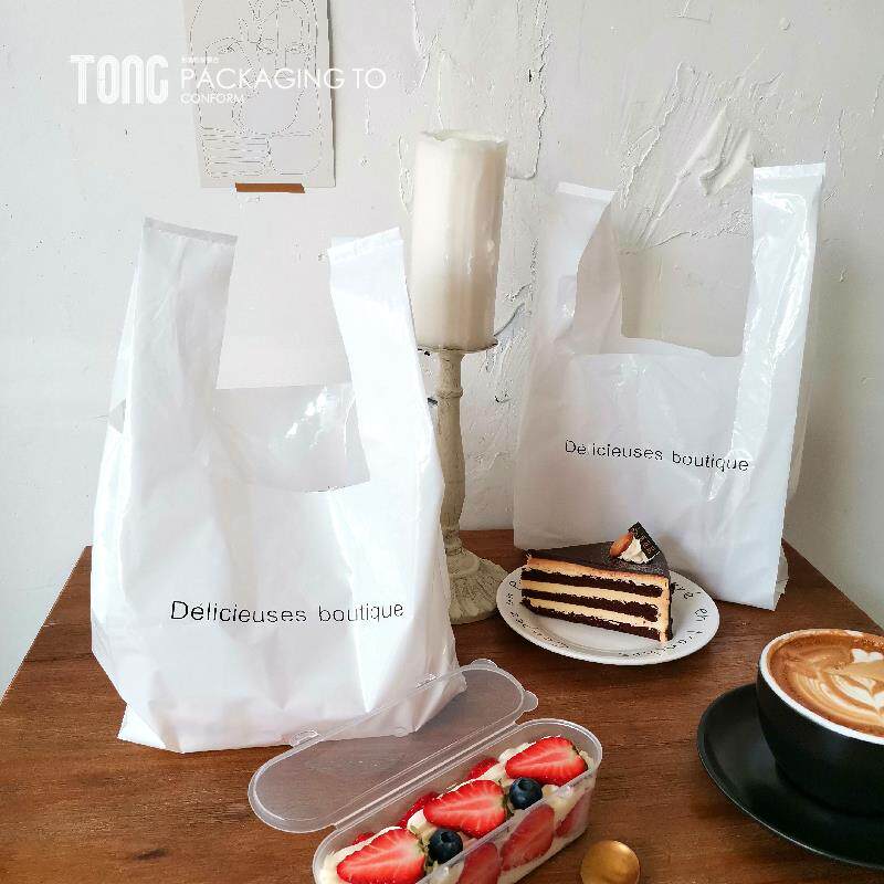 网红白色法文手提食品打包袋烘焙甜点面包西点手拎塑料透明袋定制