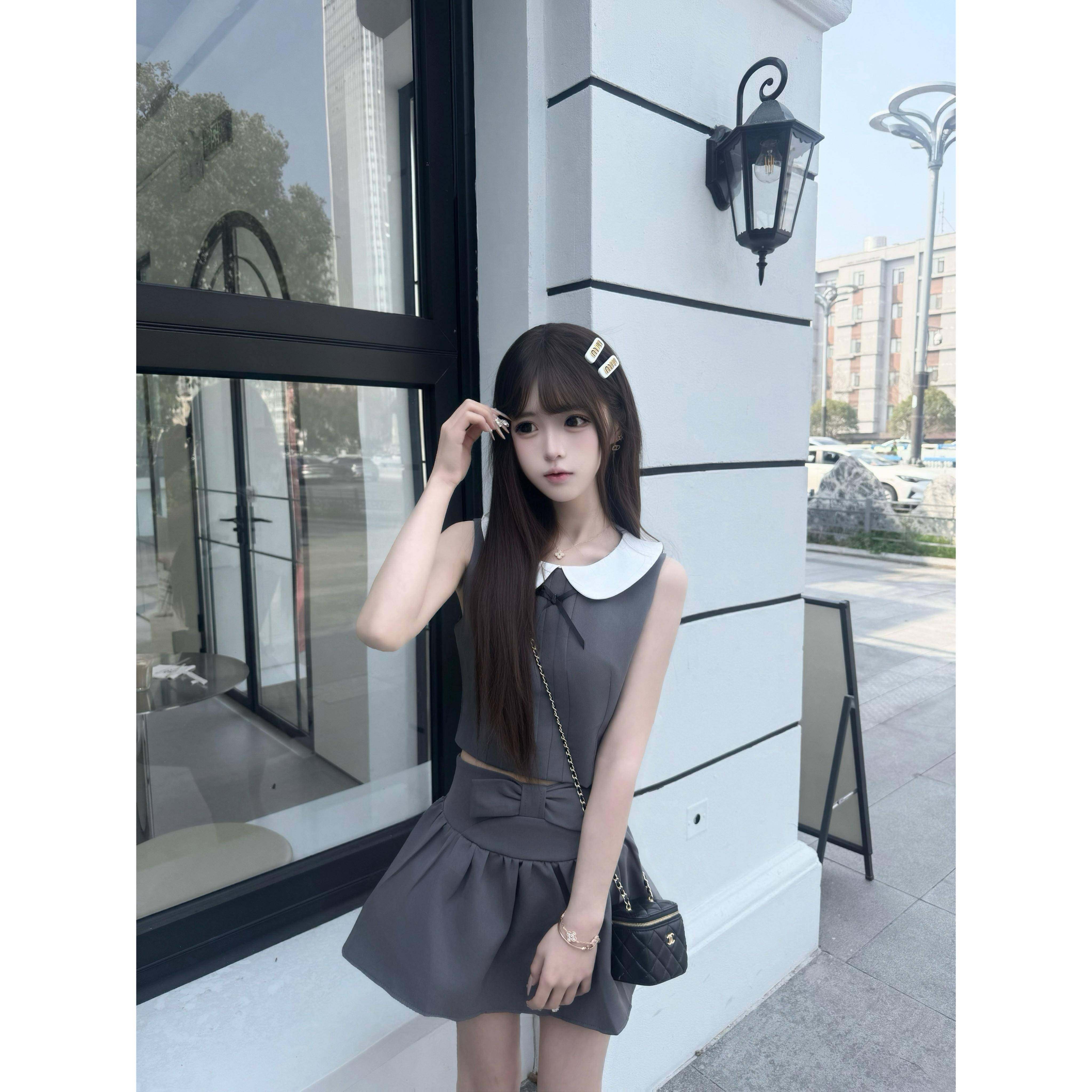 进钱钱口袋里【少女心事】蝴蝶结娃娃领无袖上衣+褶皱短裙套装女