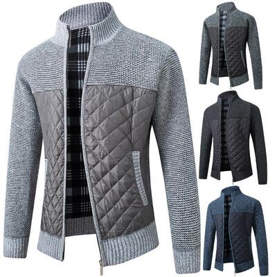 Men's knitted sweater worn over thick cardigan sweater