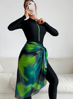 Conservative swimsuit, long sleeved pants, sunscreen beach