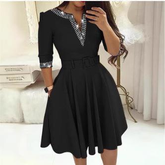 Mid long sleeved dress with waist cinched and a large