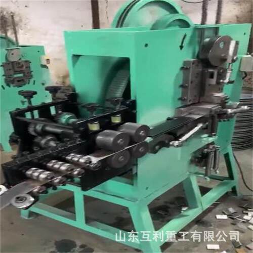 自动送料打包扣机 钢卷打包锁扣生产机 pp带化纤纸箱扣成型机