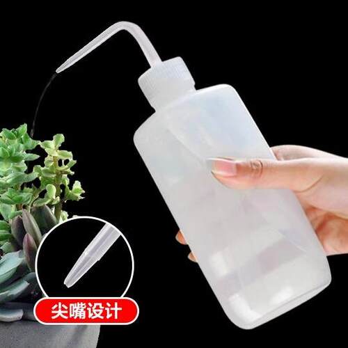 A handheld plastic transparent watering bottle with a long s