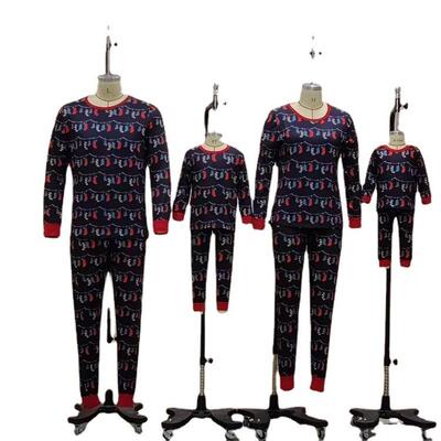 Family outfit with festive print for a family of four