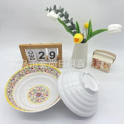 Melamine bowl with gold-painted enamel, plastic snack and co